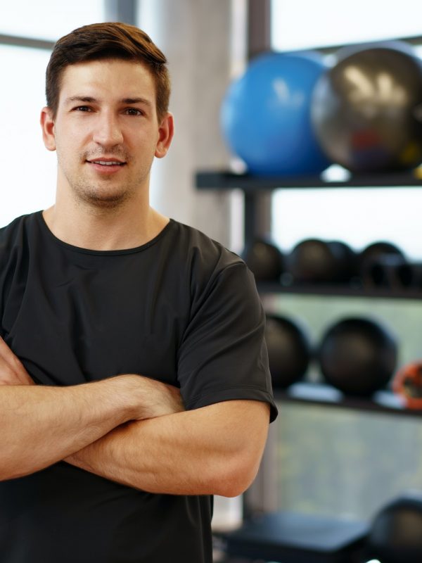 portrait-of-a-young-handsome-fitness-trainer-in-a-gym.jpg